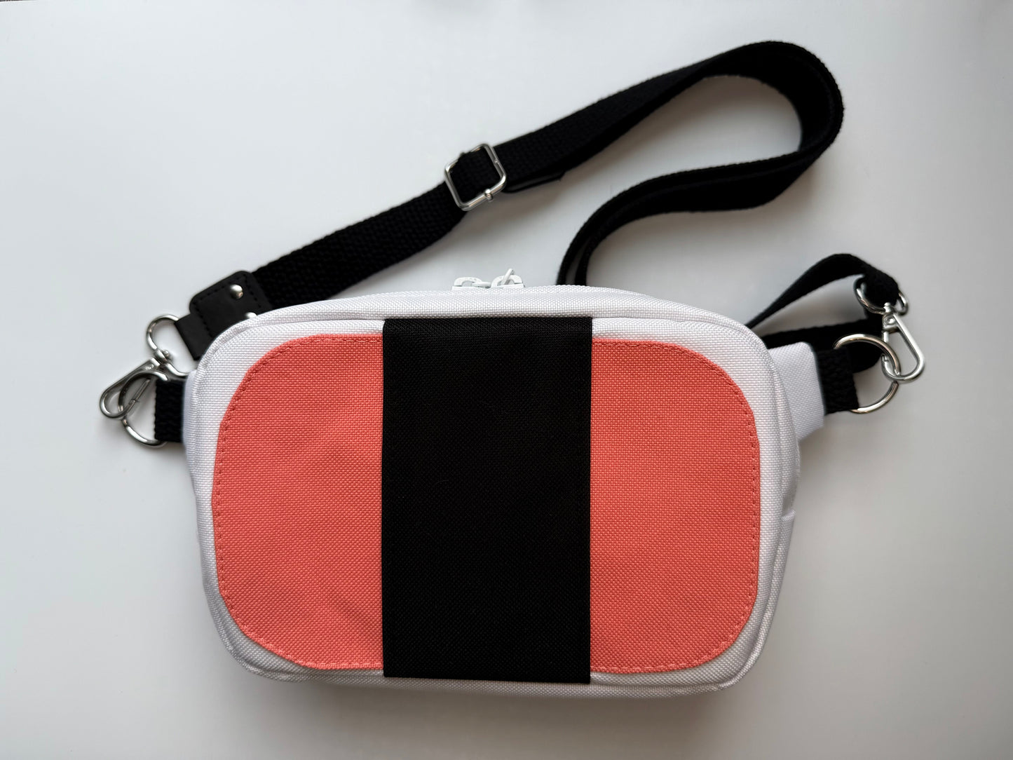small bag with a detachable strap shaped like a spam musubi 