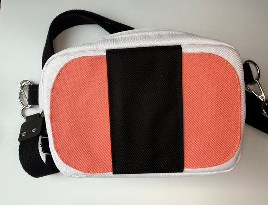 small bag with a detachable strap shaped like a spam musubi 