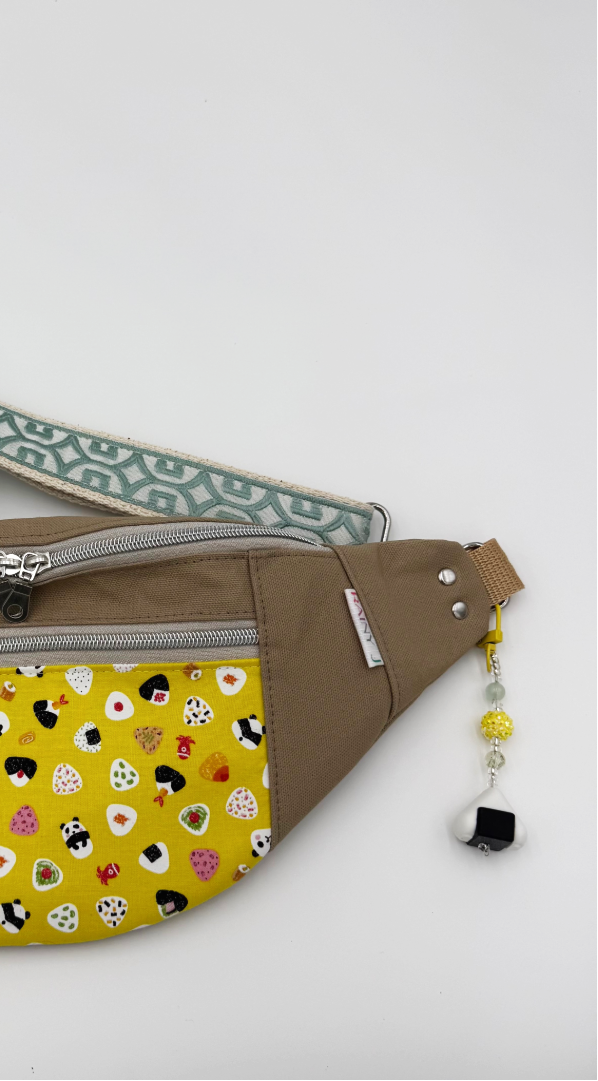 onigiri charm clipped on a belt bag
