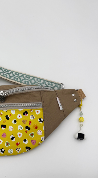 onigiri charm clipped on a belt bag