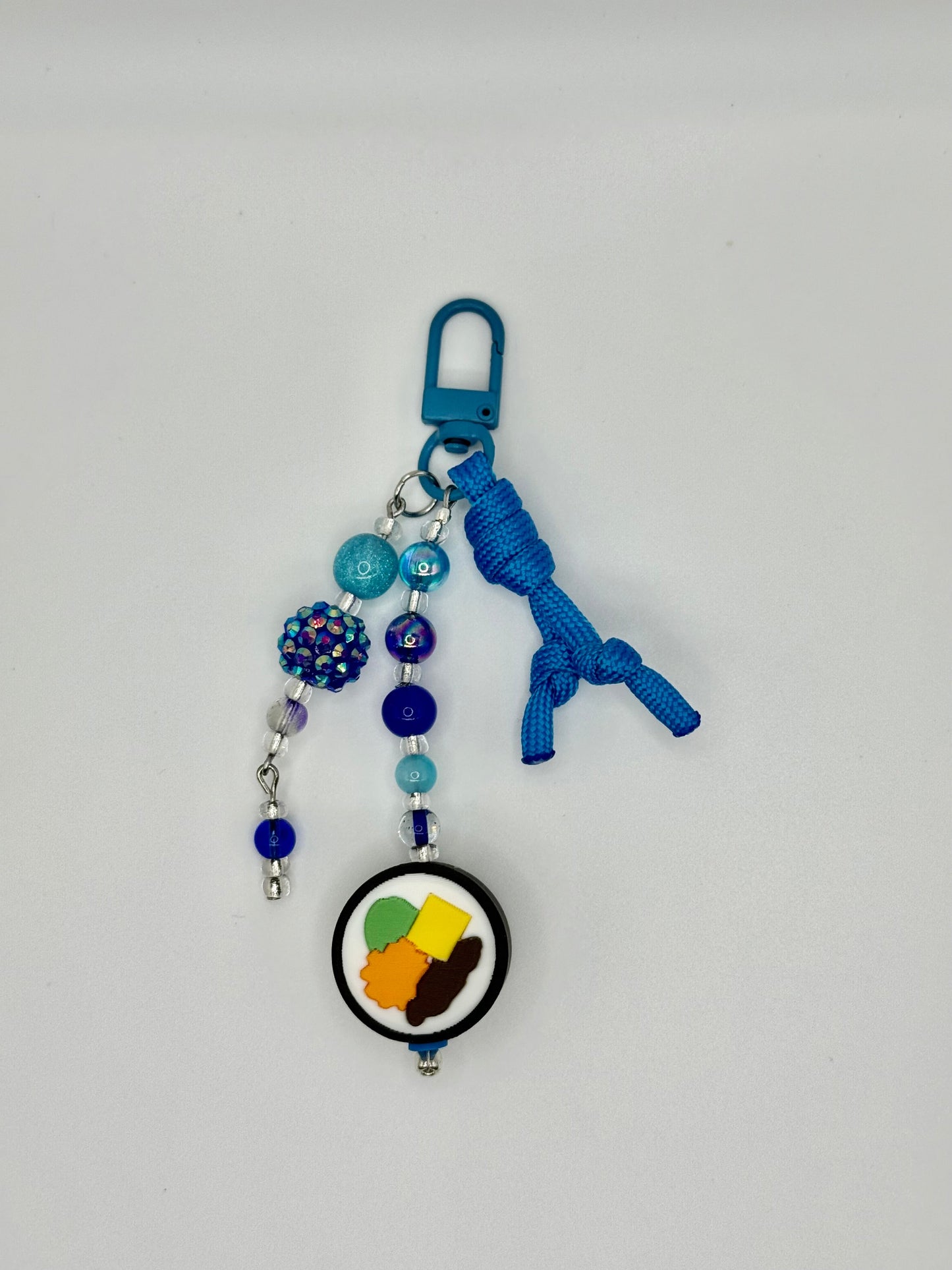 Handmade kimbap charm with rice and seaweed design, front view