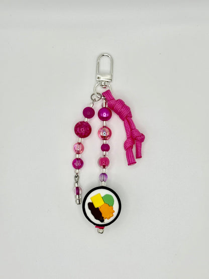 Handmade kimbap charm with rice and seaweed design, front view