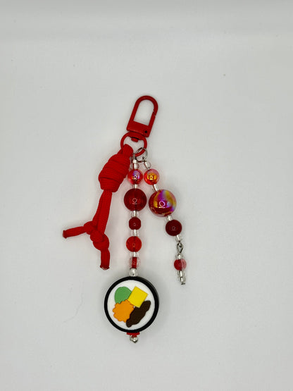 Handmade kimbap charm with rice and seaweed design, front view