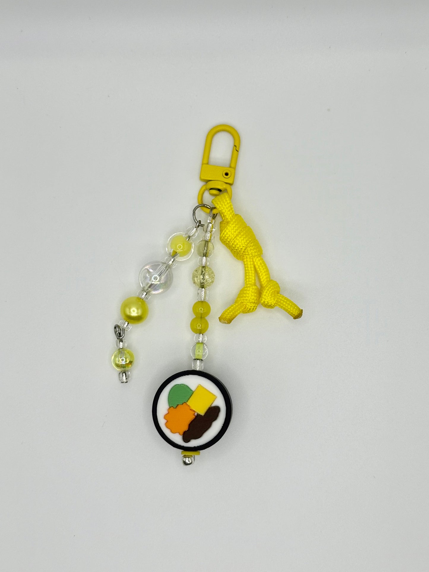 Handmade kimbap charm with rice and seaweed design, front view