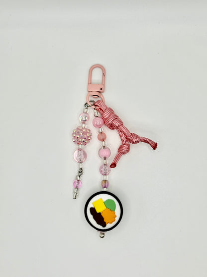 Handmade kimbap charm with rice and seaweed design, front view