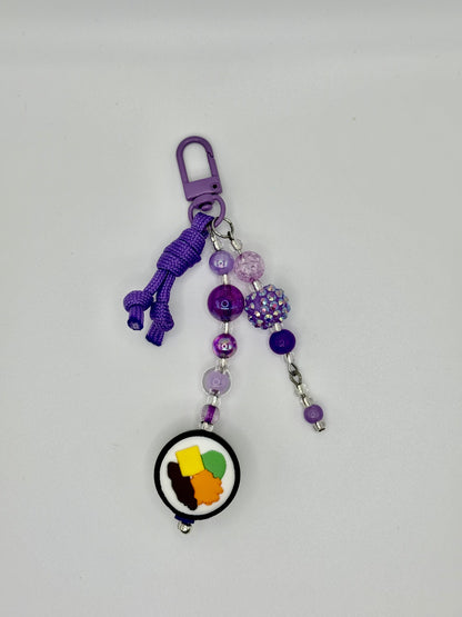 Handmade kimbap charm with rice and seaweed design, front view