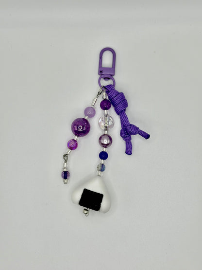 Handmade onigiri rice ball charm with seaweed wrap detail, front view.