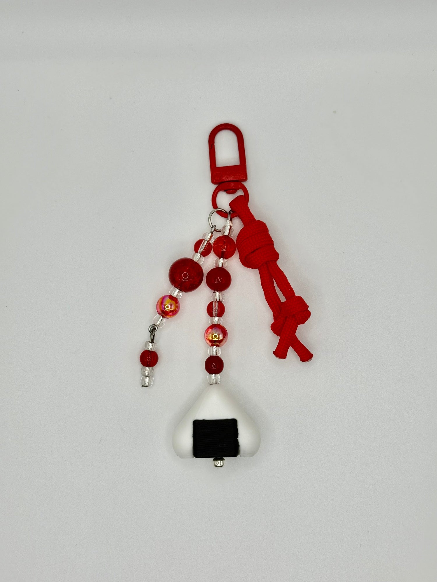 Handmade onigiri rice ball charm with seaweed wrap detail, front view