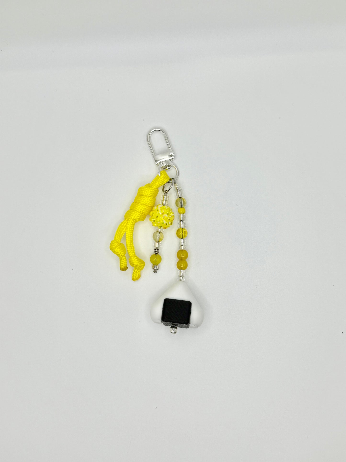 Handmade onigiri rice ball charm with seaweed wrap detail, front view